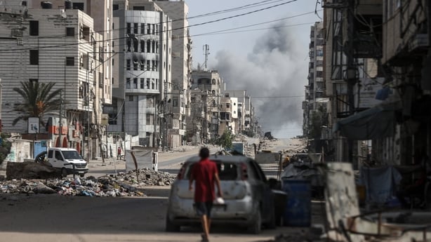 Smoke rises over destroyed residential buildings following the Israeli attacks in Gaza City