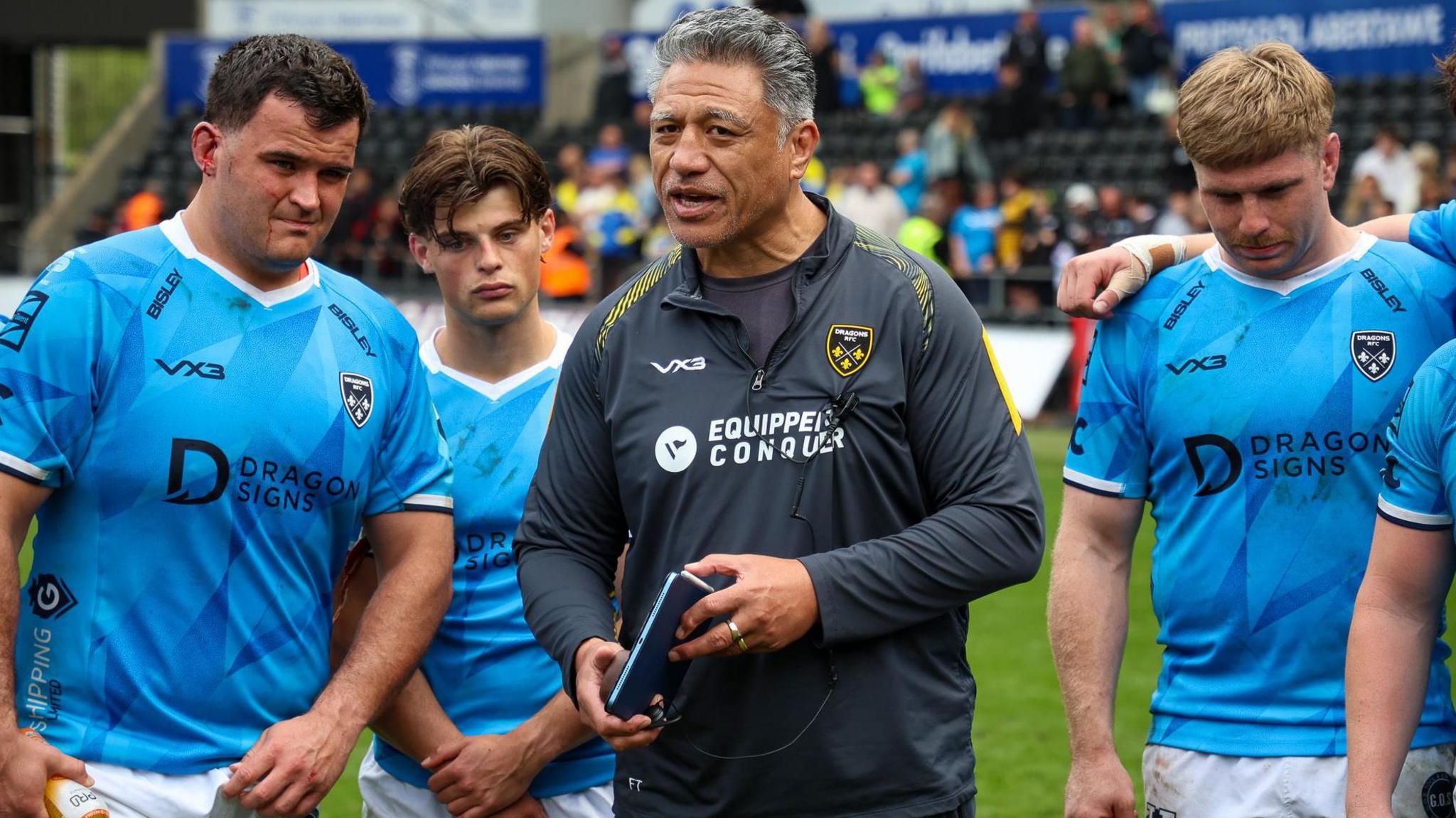 Dragons head coach Filo Tiatia talks to his players after defeat