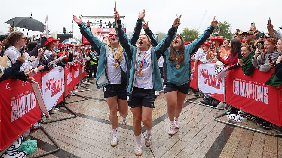 Abi Burton, Natasha Hunt and Maud Muir celebrate