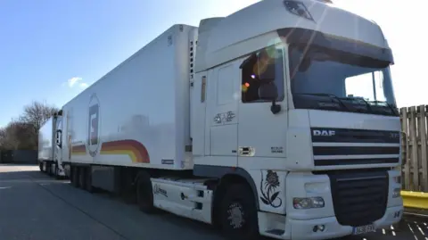 National Crime Agency Photo of the white lorry driven by a member of the people smuggling gang smashed by the National Crime Agency.