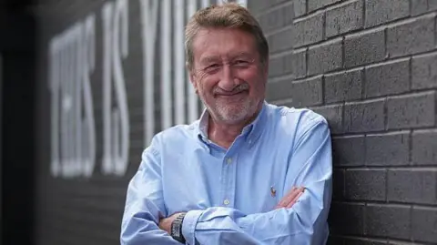 Getty Images Screenwriter Steven Knight poses during a photocall to promote the dance theatre adaptation 'Peaky Blinders: The Redemption Of Thomas Shelby,' on June 10, 2025 in Birmingham, England.