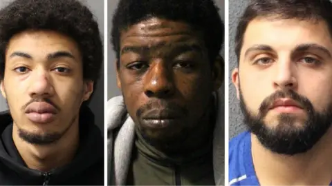 Metropolitan Police Composite of Xavier Poponne, Abel Chunda and Eden Clark police mugshots. Pomponne wears a dark tracksuit top and has short fluffy facial hair on his chin and a blemish on the side of his nose. Chunda wears a grey tracksuit jacket over an olive-green high neck shell top with a zip. He has stubble and an uneven skin tone. Clark wears a blue football shirt and a beard and moustache. All three are pictured in front of a grey wall and are looking at the camera with sullen expressions.