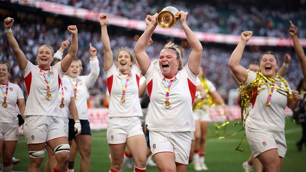 Sarah Bern holds the World Cup