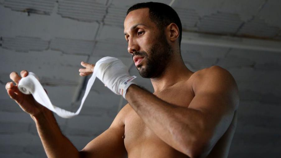 James DeGale wraps his hands in training