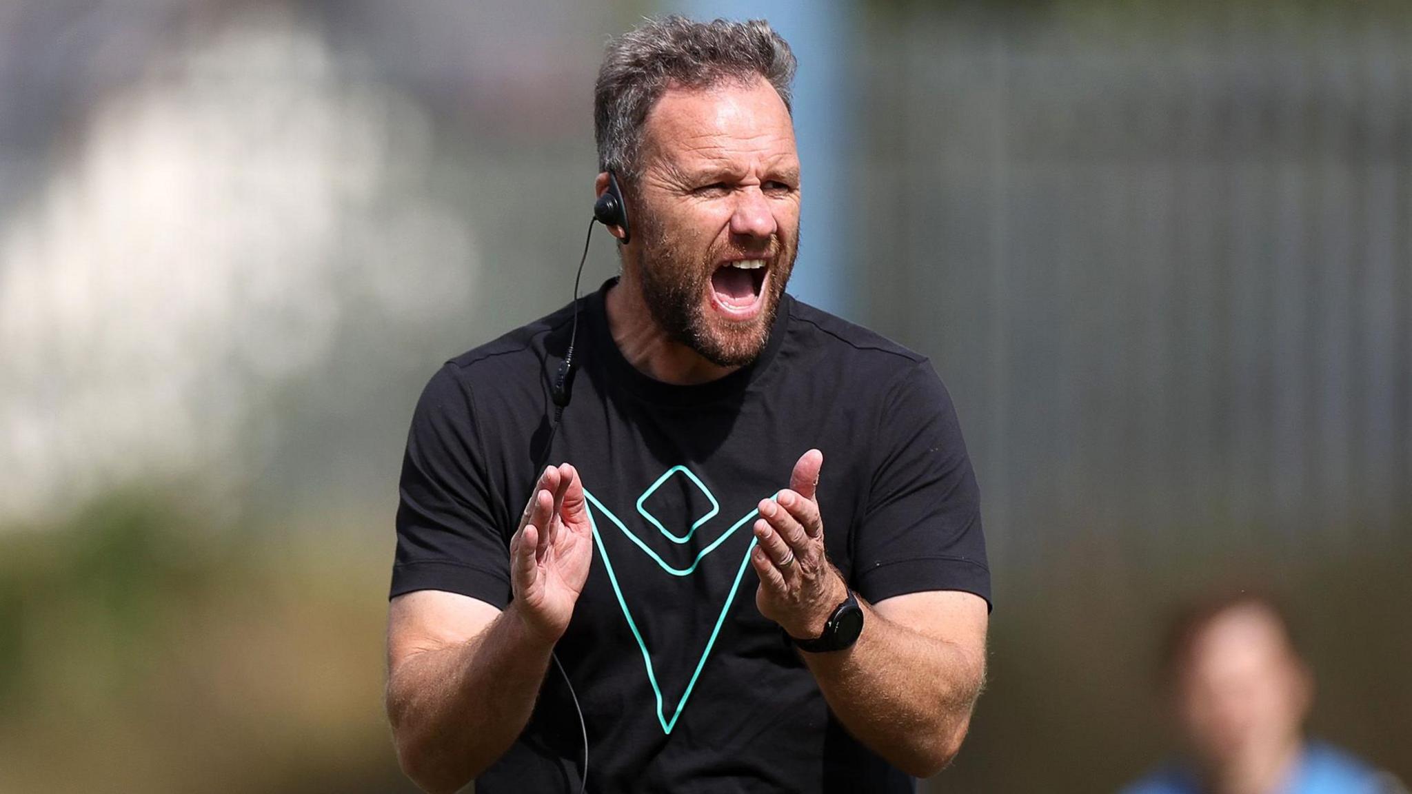 Ospreys head coach Mark Jones encourages his squad