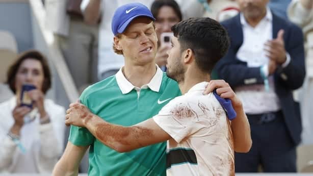 PARIS, FRANCE - JUNE 9: Carlos Alcaraz of Spain (R) salutes Jannik Sinner of Italy at the net after his victory in the men's final on day 15 of the 2025 French Open, Roland-Garros 2025, Grand Slam tennis tournament at Roland Garros stadium on June 8, 2025 in Paris, France. (Photo by Jean Catuffe/Get